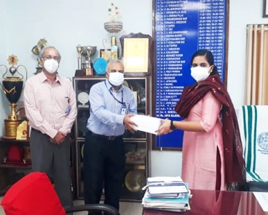 Mr Ashok P Menon (CEO) is handing over the personal protective items to the Mayor, Ms. Arya Rajendran for the Covid Control Centre in the presence of the COO, Dr Abraham Thomas